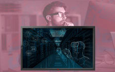 A man with his hand on his chin thinking things behind of a computer screen