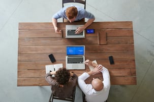 Three men in a discussion
